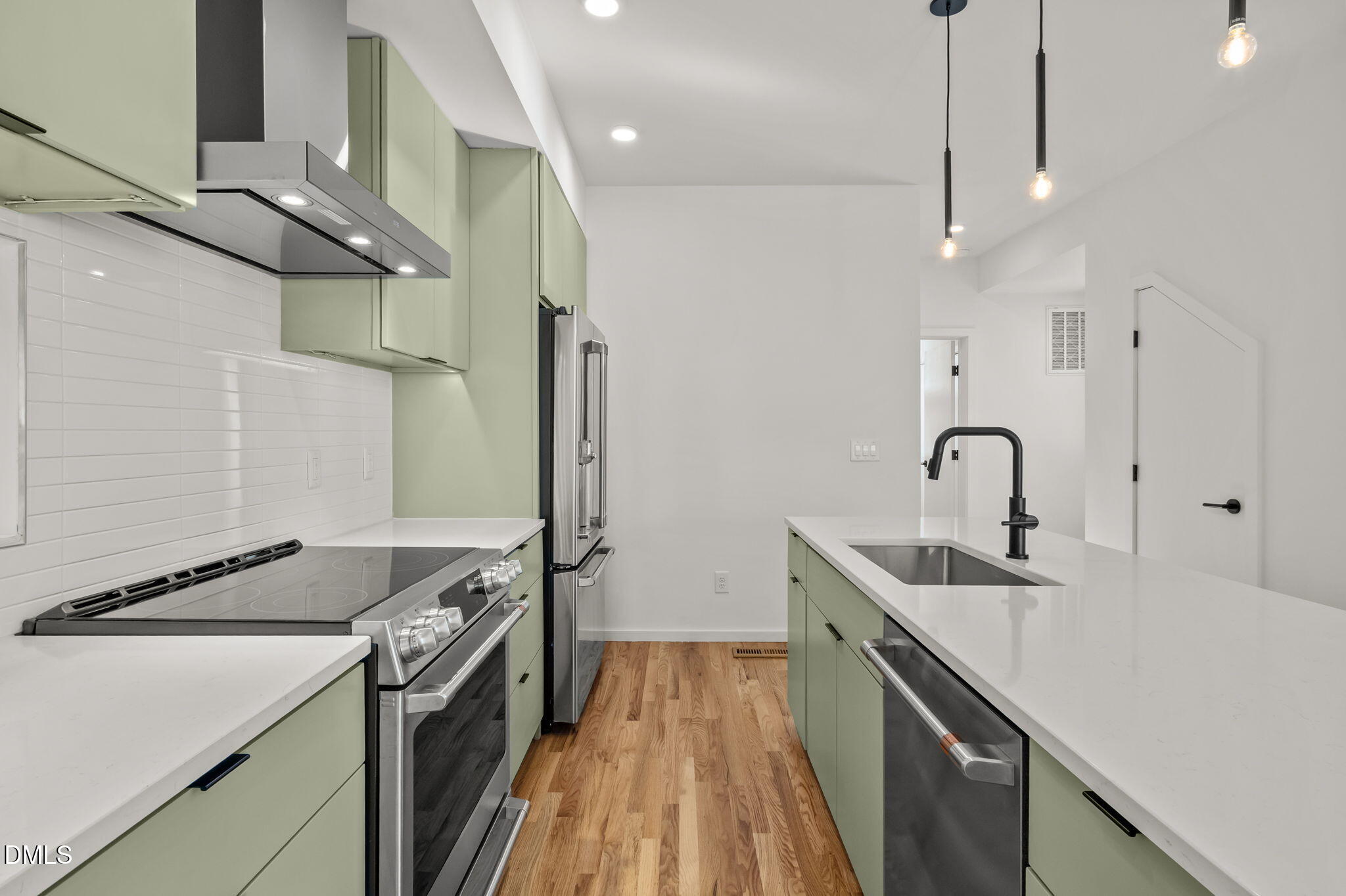 1605 Glendale Avenue Durham, NC 27701 - Photo 15 of 41 a kitchen with stainless steel appliances a sink a stove and a refrigerator