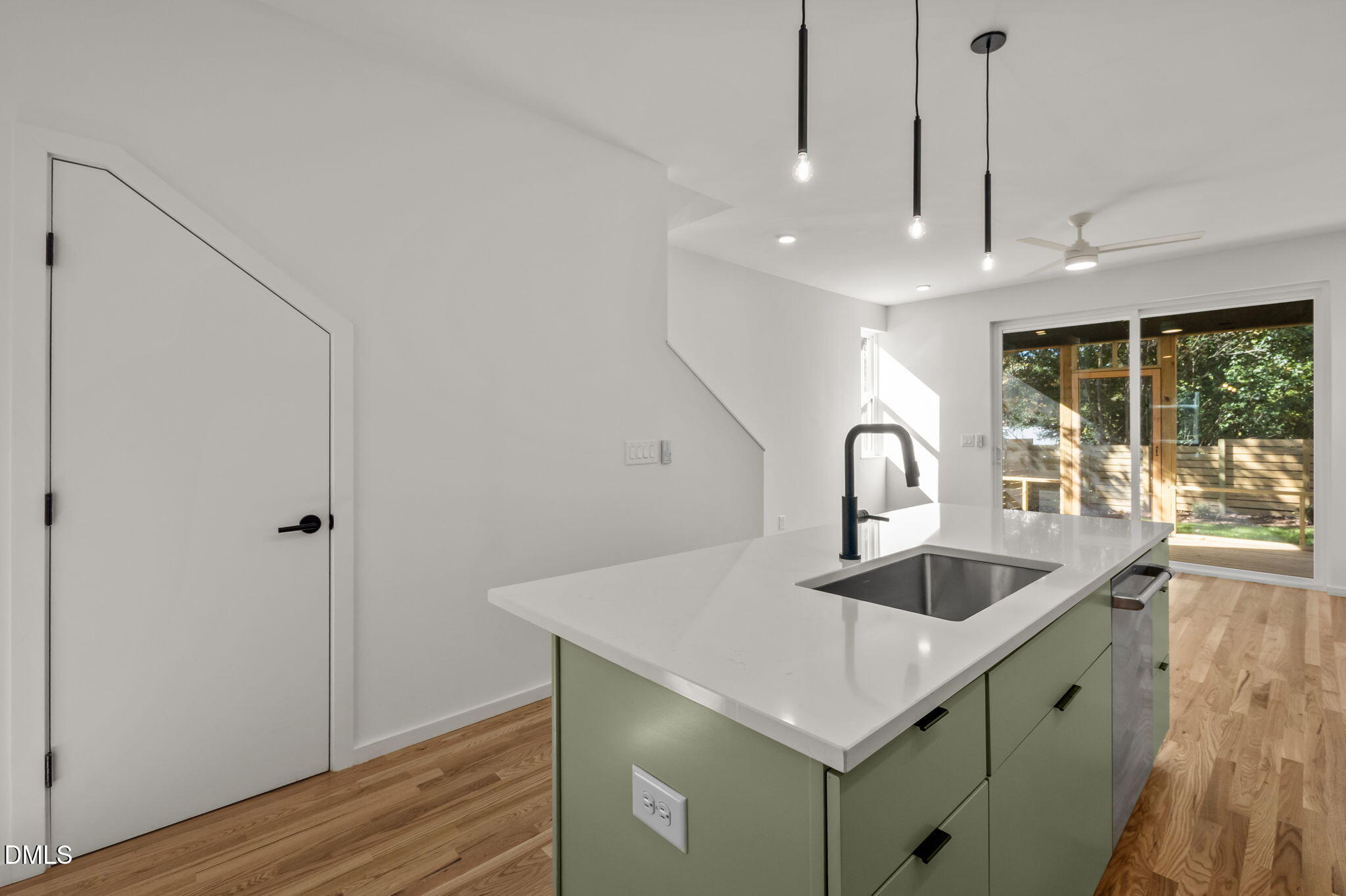 1605 Glendale Avenue Durham, NC 27701 - Photo 16 of 41 a kitchen with kitchen island a sink and a refrigerator