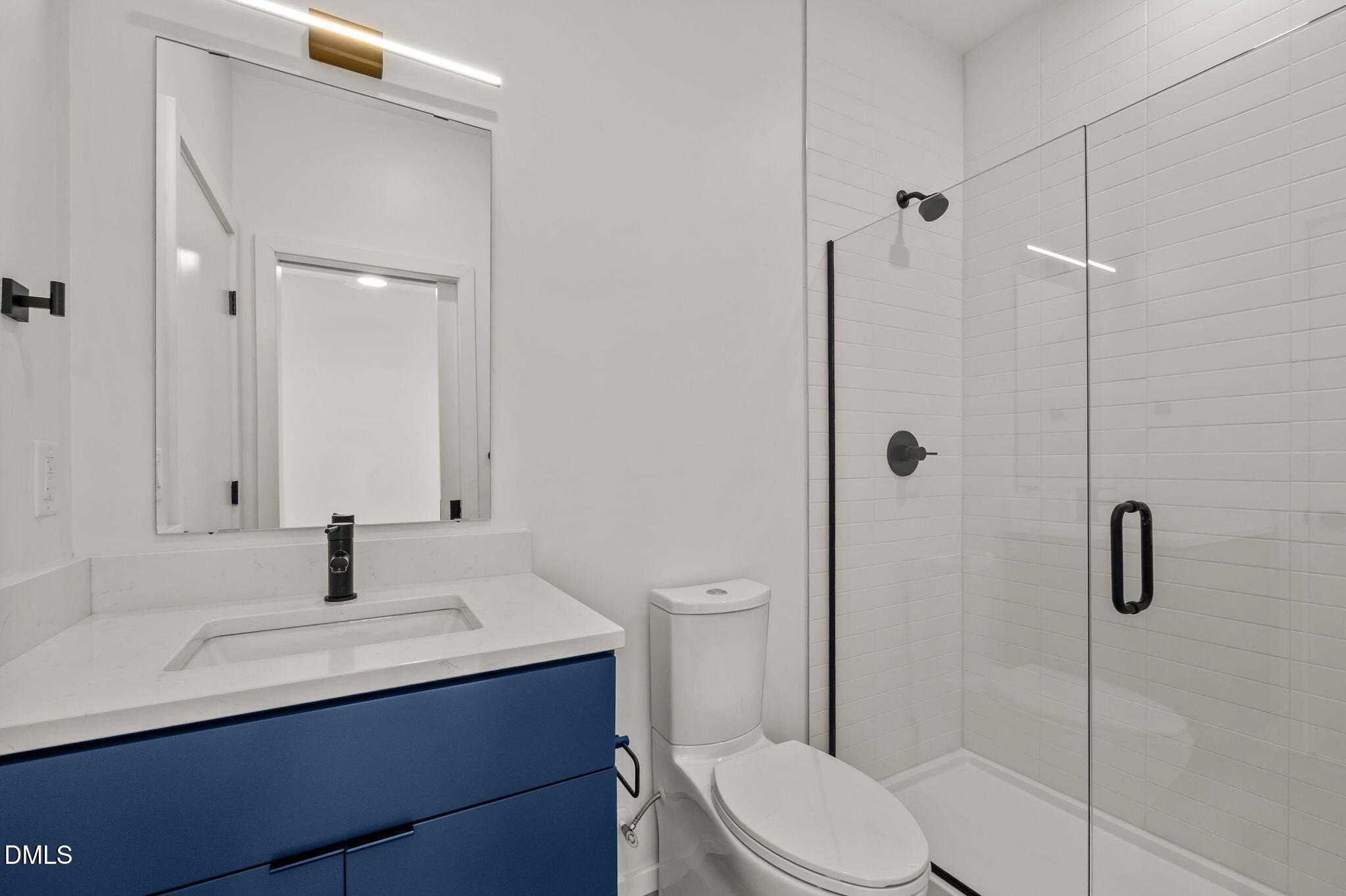 1605 Glendale Avenue Durham, NC 27701 - Photo 19 of 41 a bathroom with a sink toilet and shower