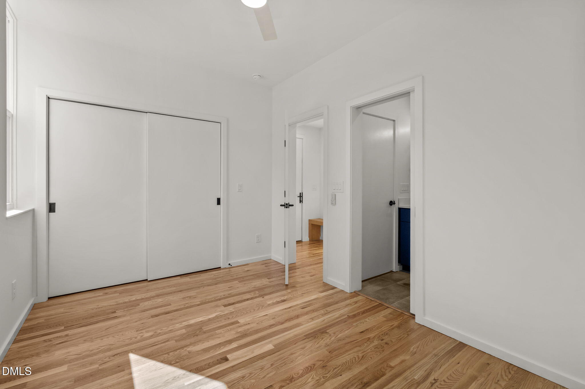 1605 Glendale Avenue Durham, NC 27701 - Photo 20 of 41 a view of a room with wooden floor and white walls