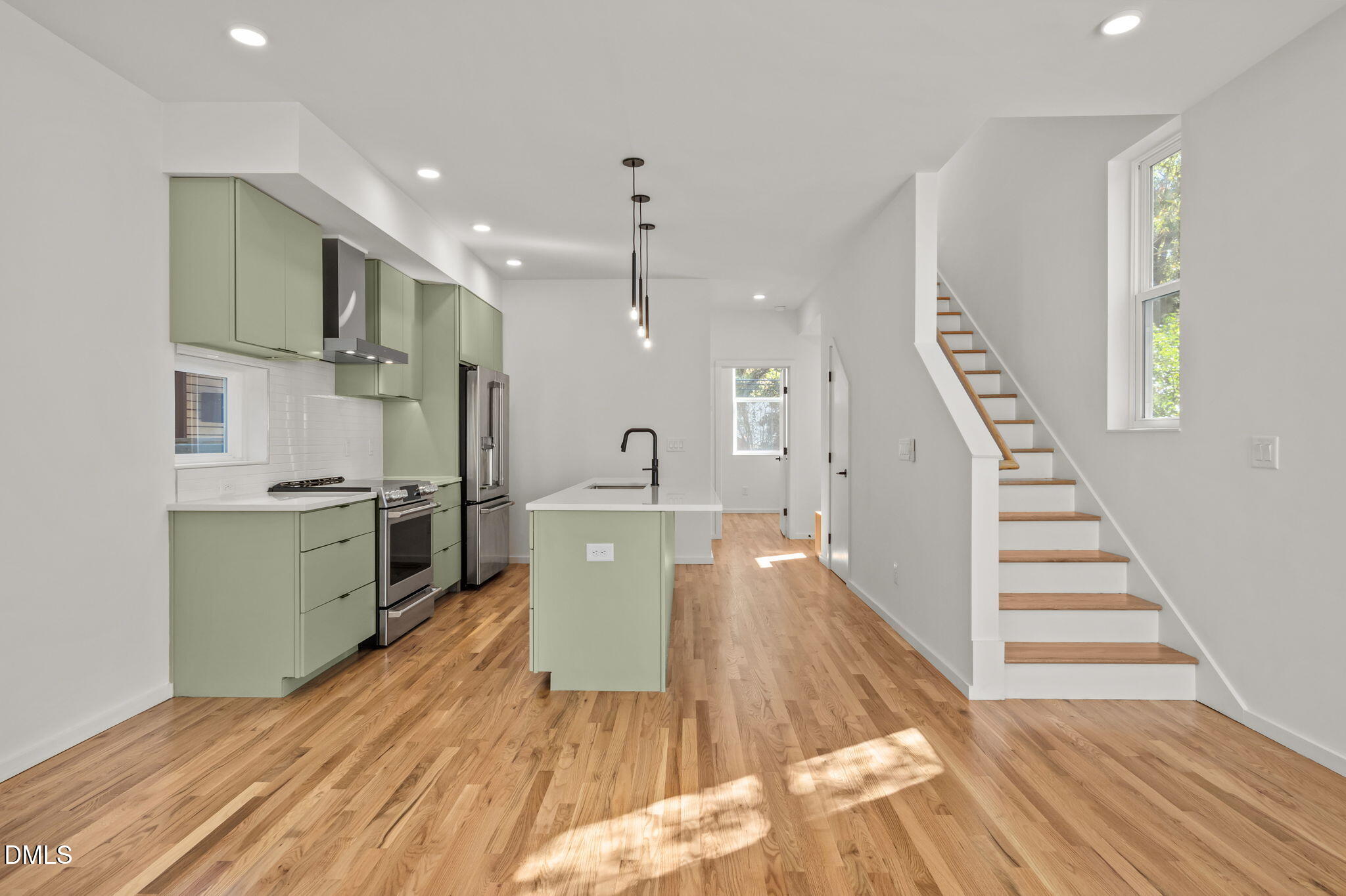 1605 Glendale Avenue Durham, NC 27701 - Photo 22 of 41 a open kitchen with white cabinets and stainless steel appliances
