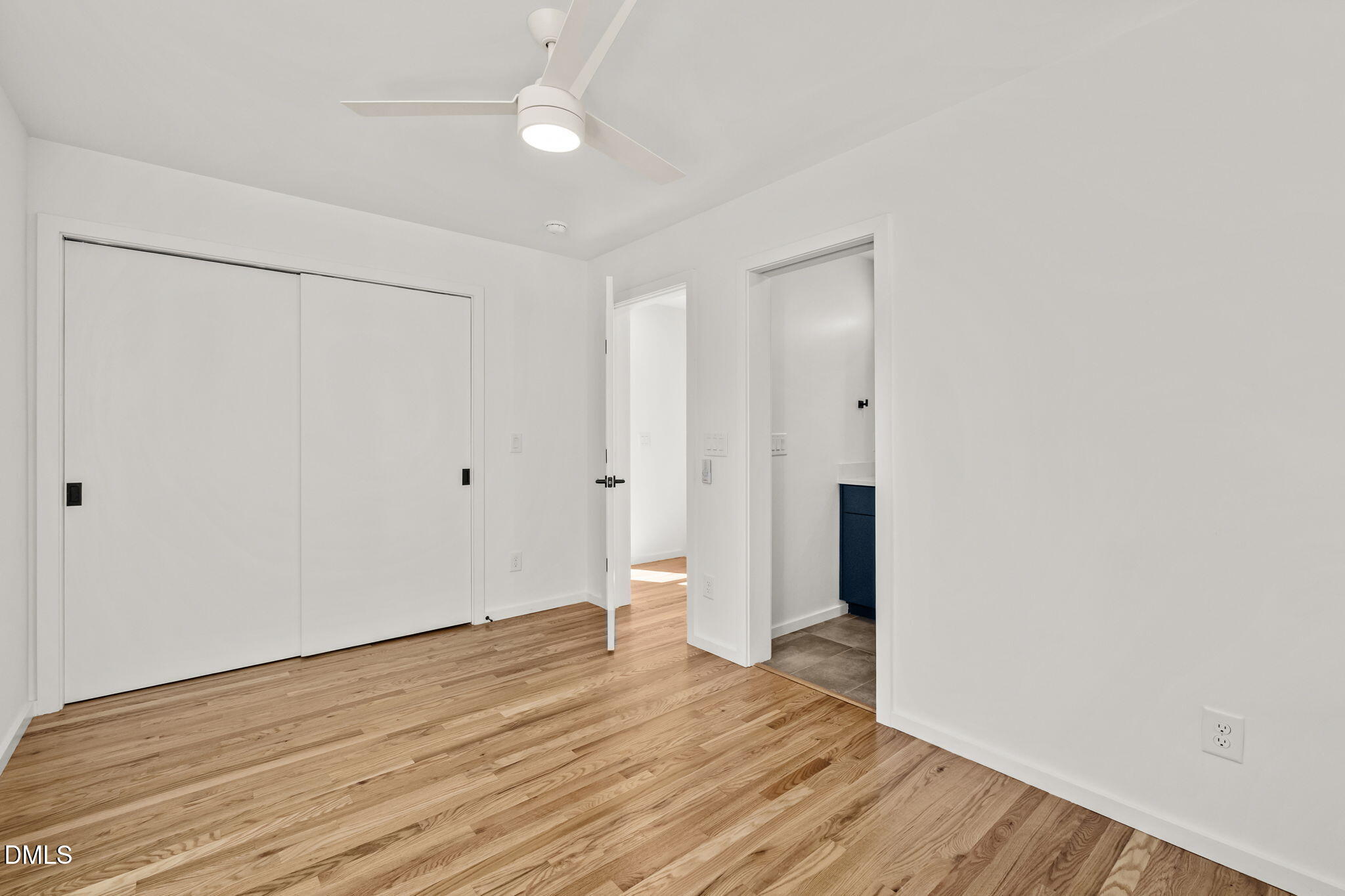 1605 Glendale Avenue Durham, NC 27701 - Photo 25 of 41 an empty room with wooden floor and white walls