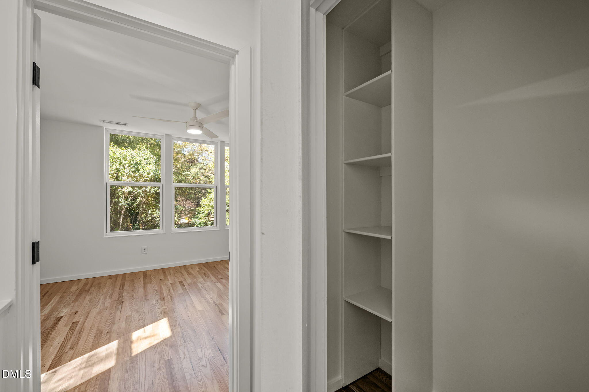 1605 Glendale Avenue Durham, NC 27701 - Photo 28 of 41 a view of an empty room with wooden floor and a window