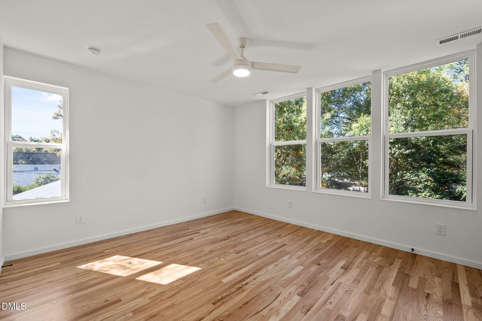 1605 Glendale Avenue Durham, NC 27701 - Photo 29 of 41 a view of empty room with wooden floor and fan