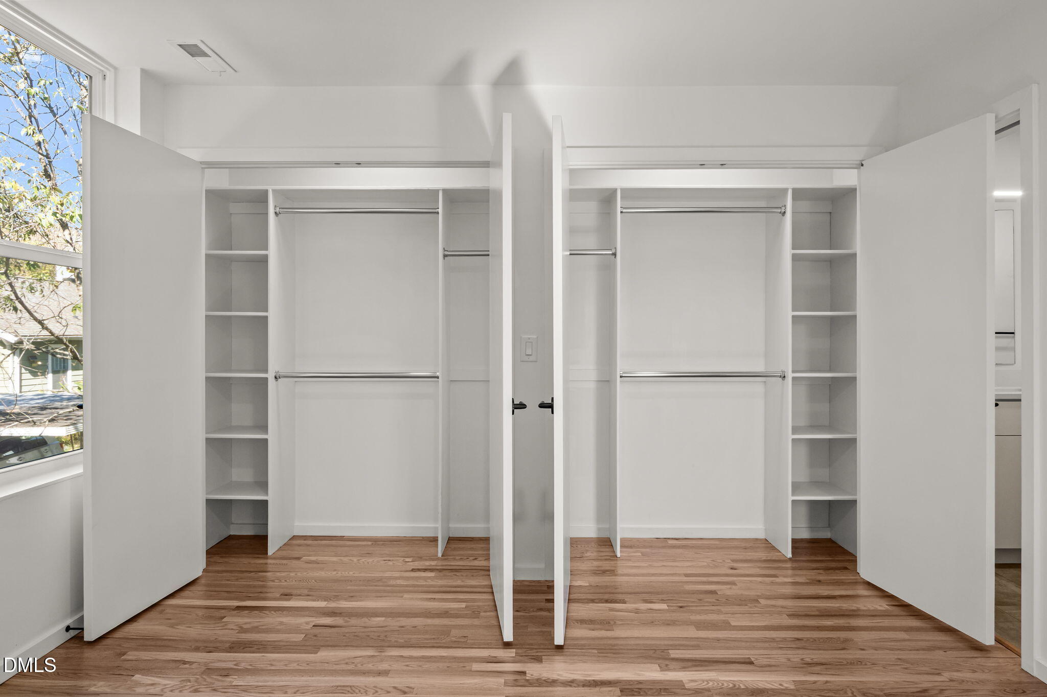 1605 Glendale Avenue Durham, NC 27701 - Photo 31 of 41 a view of an empty room with wooden floor and closet