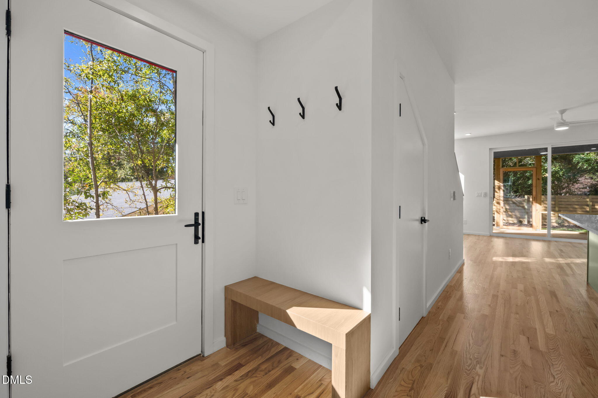1605 Glendale Avenue Durham, NC 27701 - Photo 5 of 41 a view of a hallway with wooden floor and a bathroom