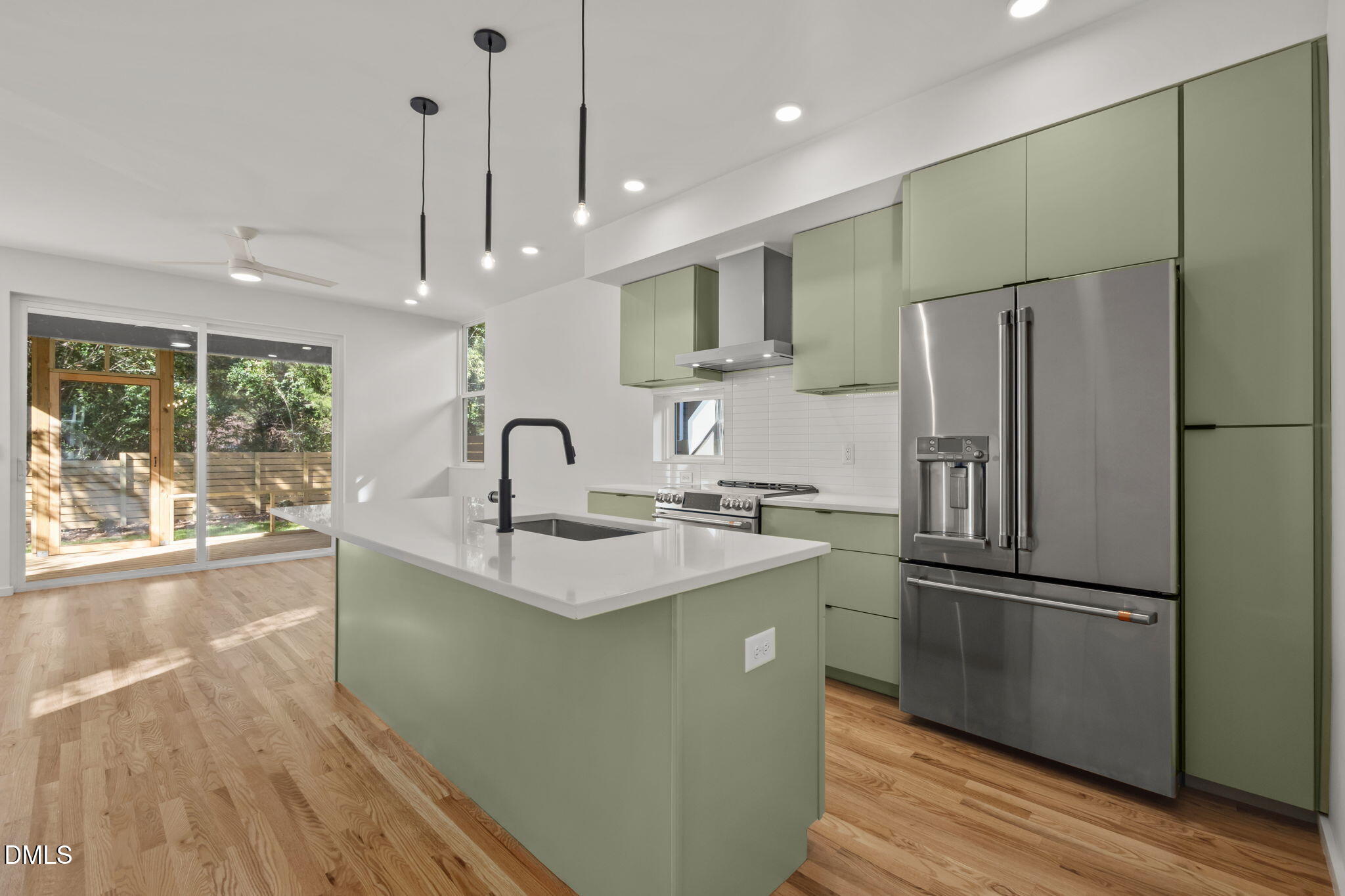 1605 Glendale Avenue Durham, NC 27701 - Photo 6 of 41 a kitchen with kitchen island a sink appliances and cabinets