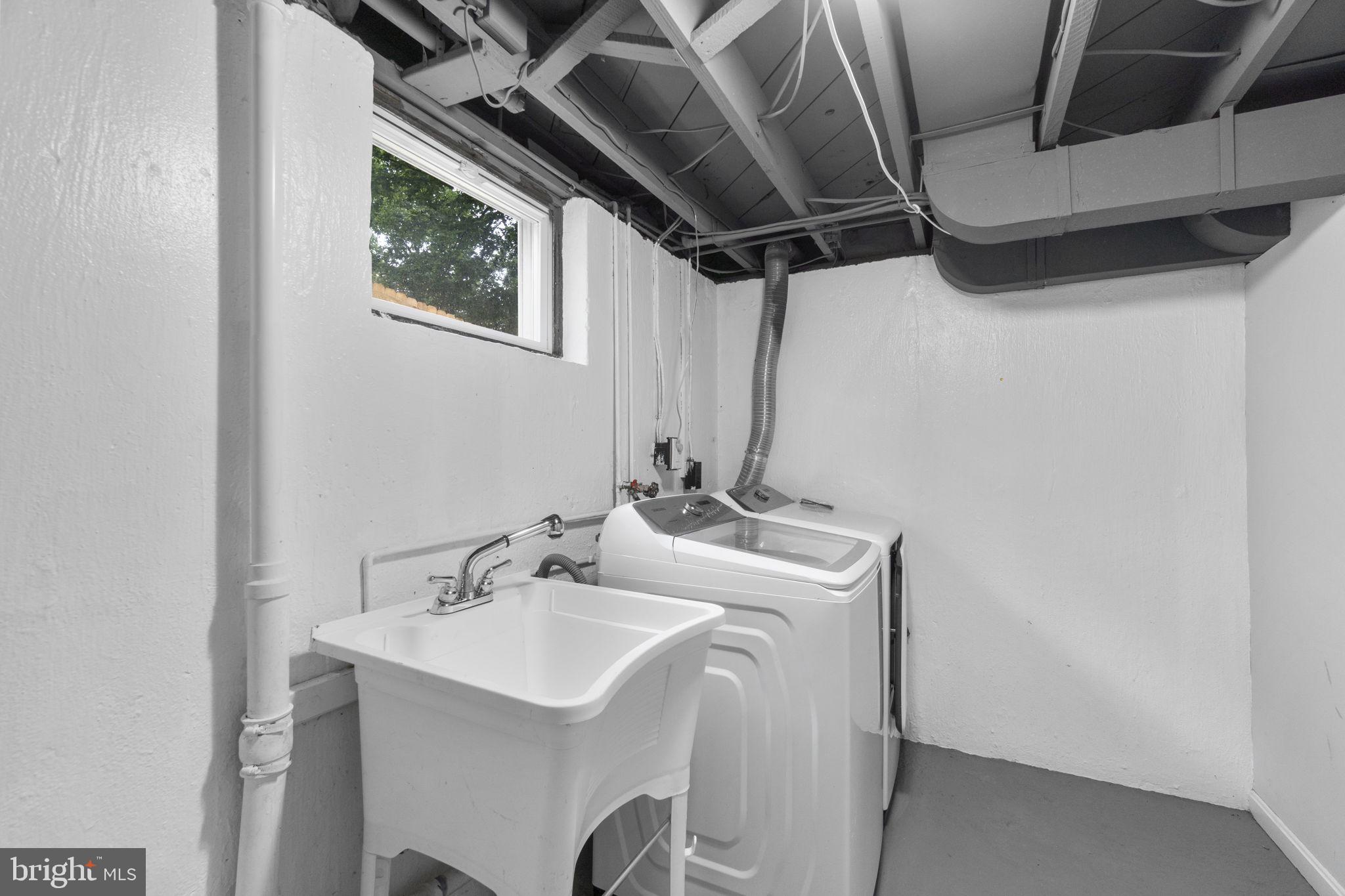3658 Clifmar Road Baltimore, MD 21244 - Photo 35 of 43 a utility room with dryer and washer