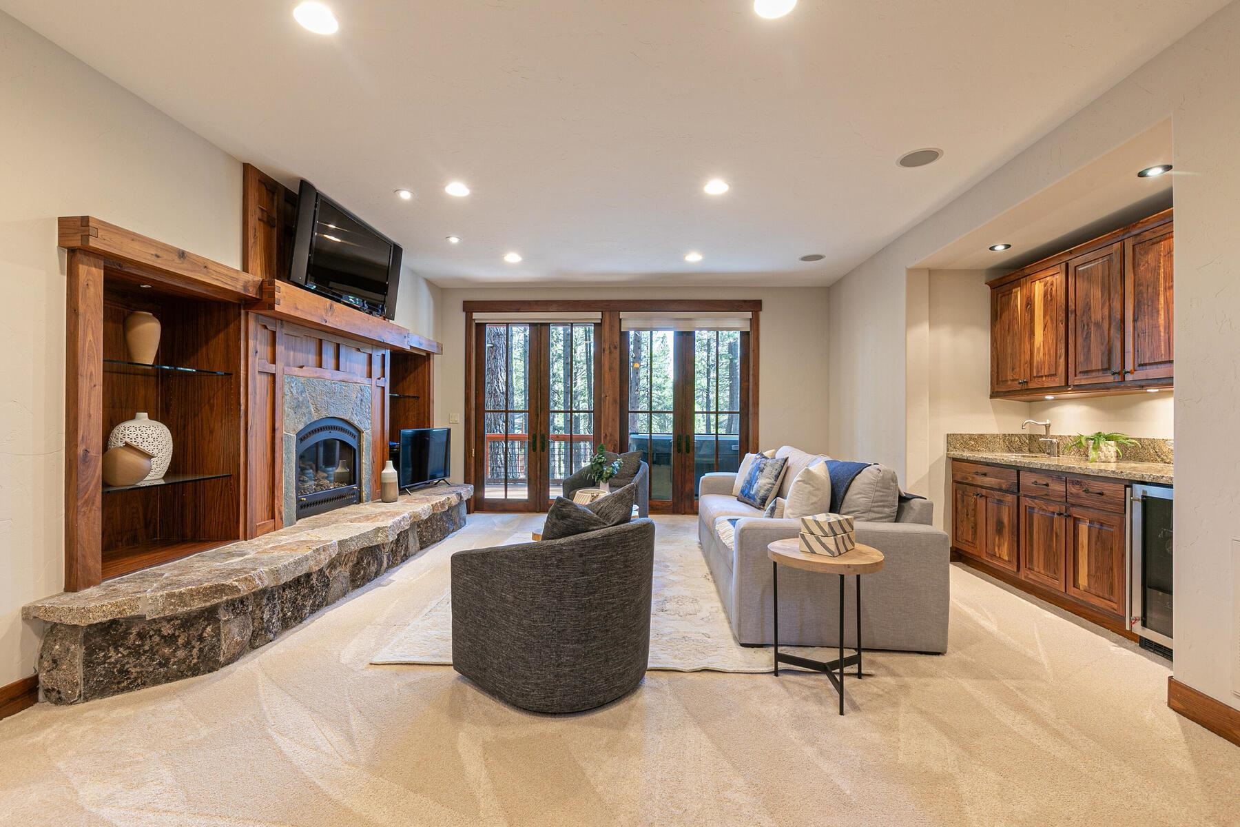11541 Bottcher Loop Truckee, CA 96161 - Photo 17 of 28 a living room with furniture a fireplace and a kitchen island