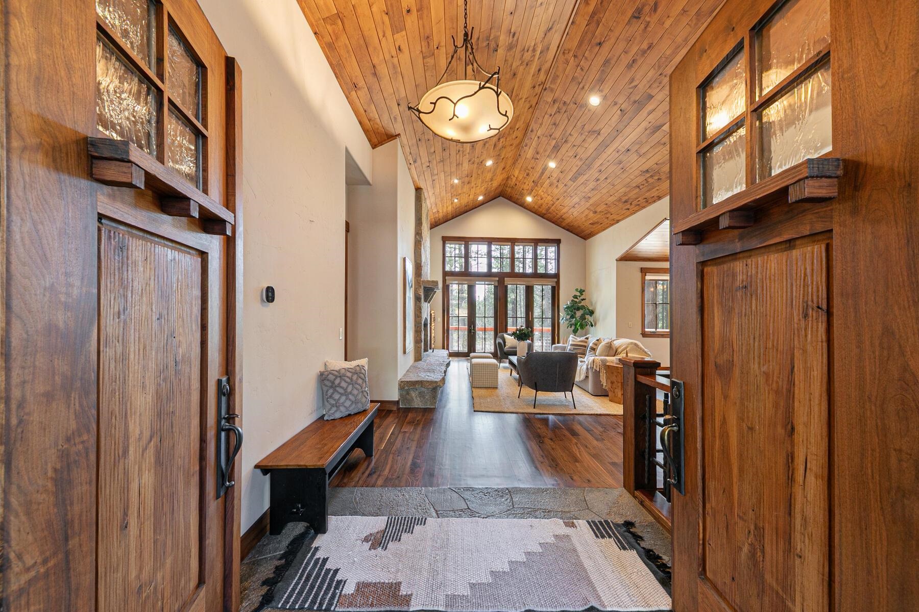 11541 Bottcher Loop Truckee, CA 96161 - Photo 4 of 28 a very nice looking room with a large window and chandelier