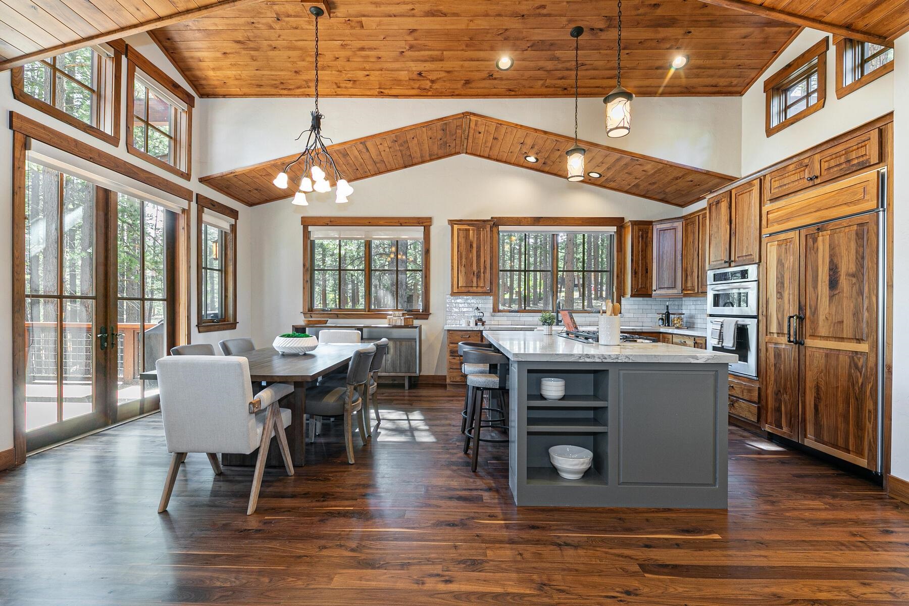 11541 Bottcher Loop Truckee, CA 96161 - Photo 7 of 28 a dining table with chairs and wooden floor