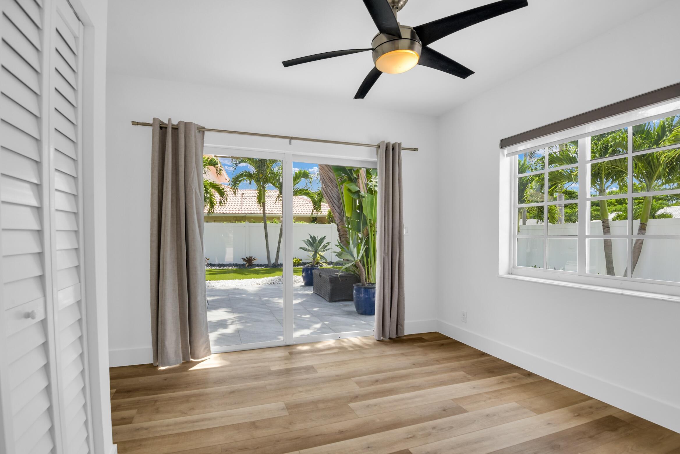 701 Appleby Street Boca Raton, FL 33487 - Photo 42 of 47 an empty room with wooden floor and windows