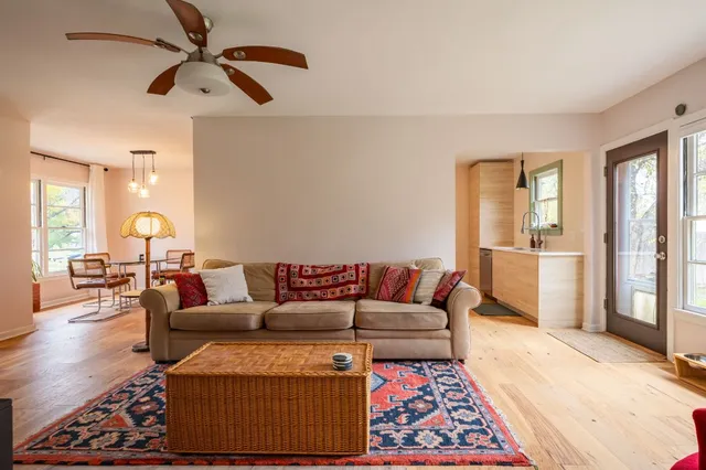 a living room with furniture and a rug