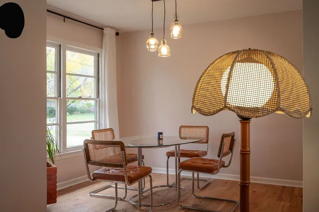 a view of a livingroom with furniture and a window