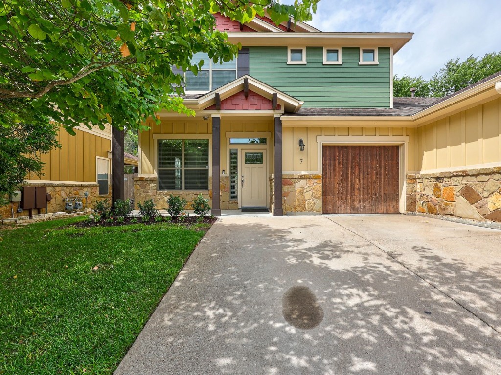6708 Menchaca Road, Unit 7 Austin, TX 78745 - Photo 2 of 32 a front view of a house with garden