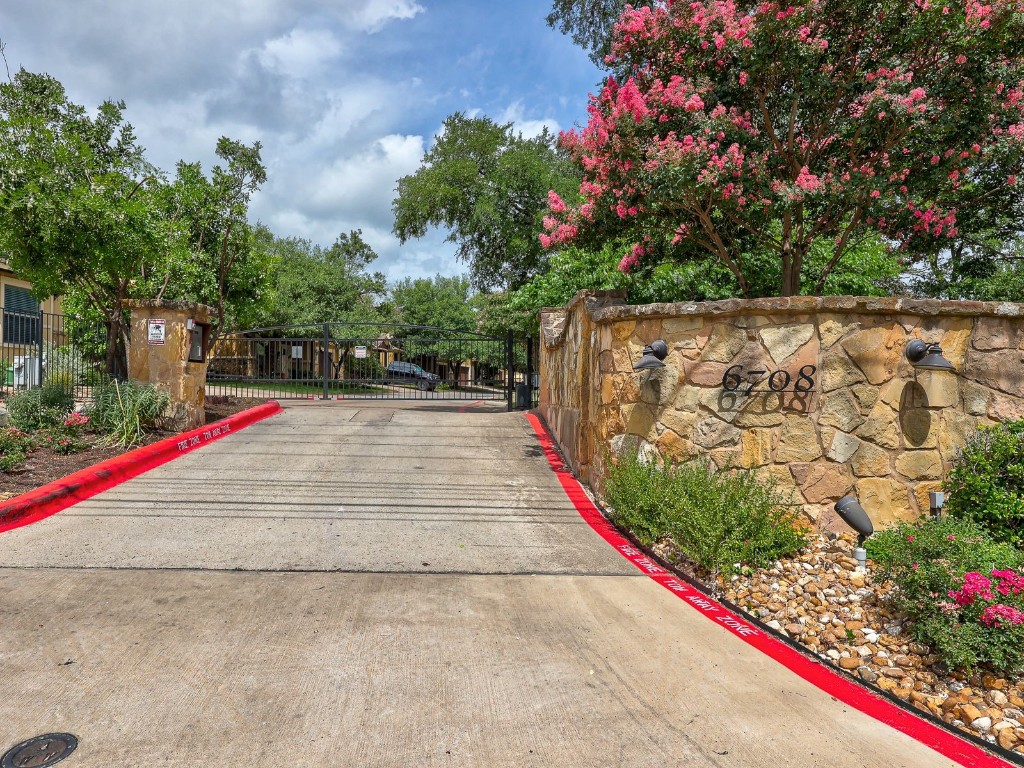 6708 Menchaca Road, Unit 7 Austin, TX 78745 - Photo 28 of 32 a view of small pond with flower plants