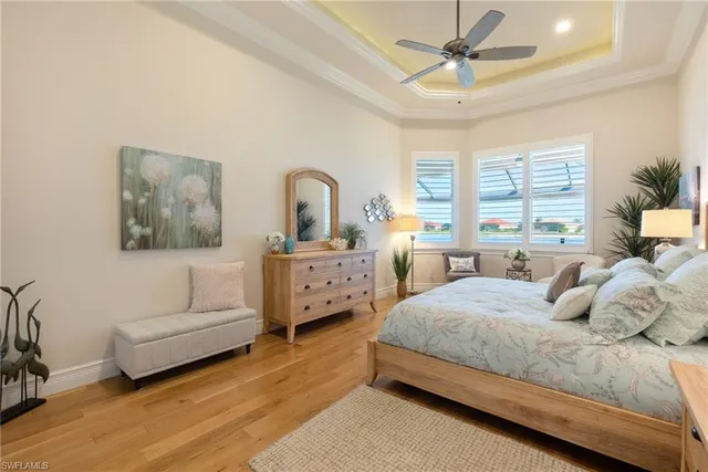 a bedroom with a bed couch and window