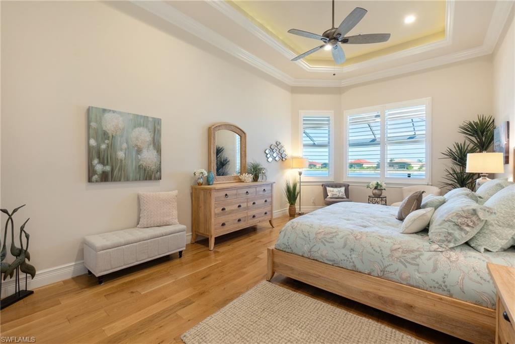 18018 Broadview Drive Naples, FL 34114 - Photo 17 of 46 a bedroom with a bed couch and window