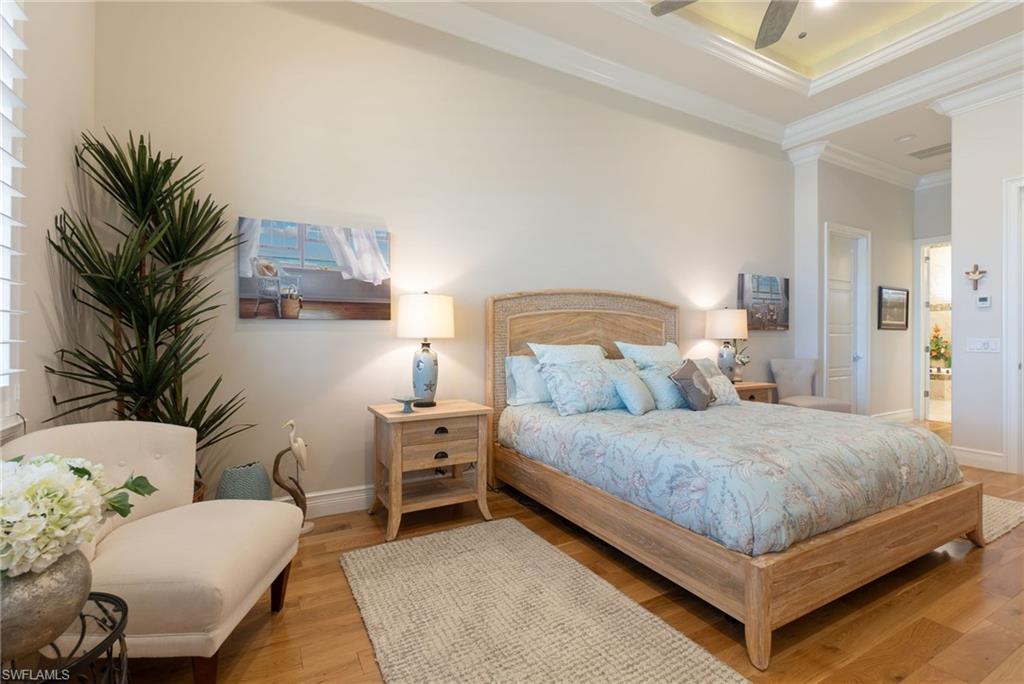 18018 Broadview Drive Naples, FL 34114 - Photo 18 of 46 a bedroom with a bed and a couch