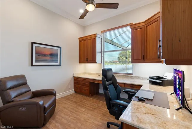a work room with furniture and a window