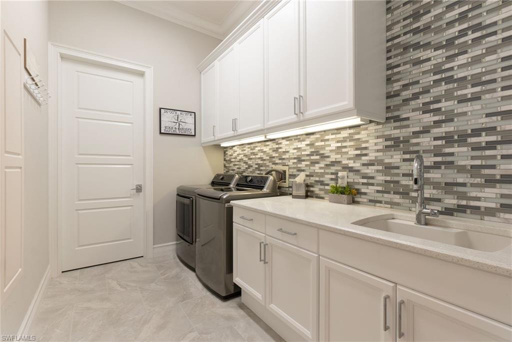 18018 Broadview Drive Naples, FL 34114 - Photo 27 of 46 a view of a storage and utility room with sink
