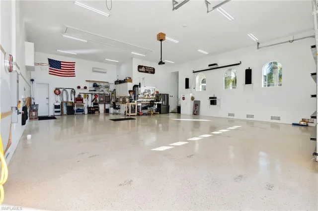 a living room with lots of furniture and white walls