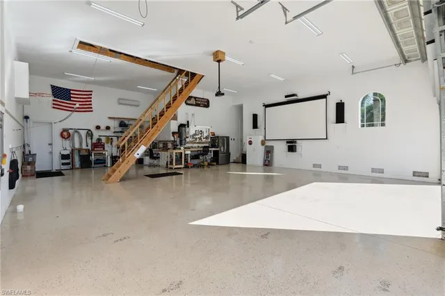 a view of a kitchen with furniture and a flat screen tv