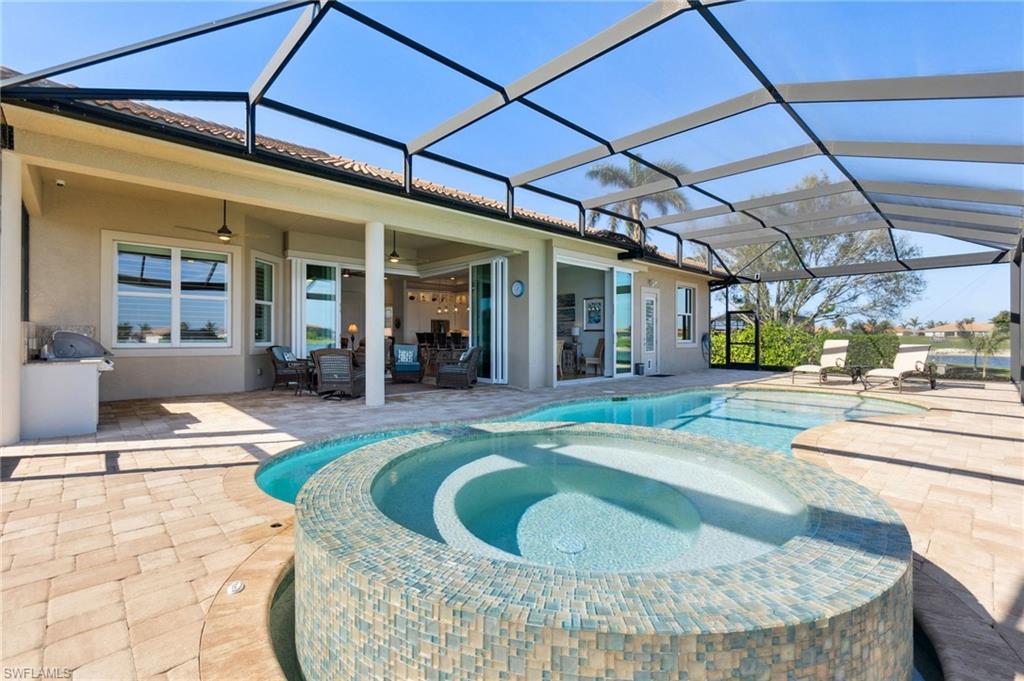 18018 Broadview Drive Naples, FL 34114 - Photo 35 of 46 a view of a living room and kitchen