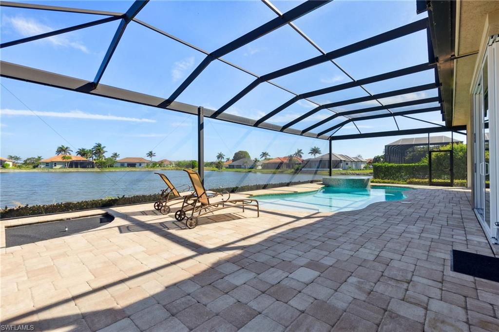 18018 Broadview Drive Naples, FL 34114 - Photo 37 of 46 a view of a swimming pool with a patio