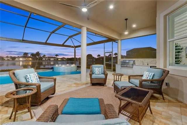 a patio with patio a couch and chairs