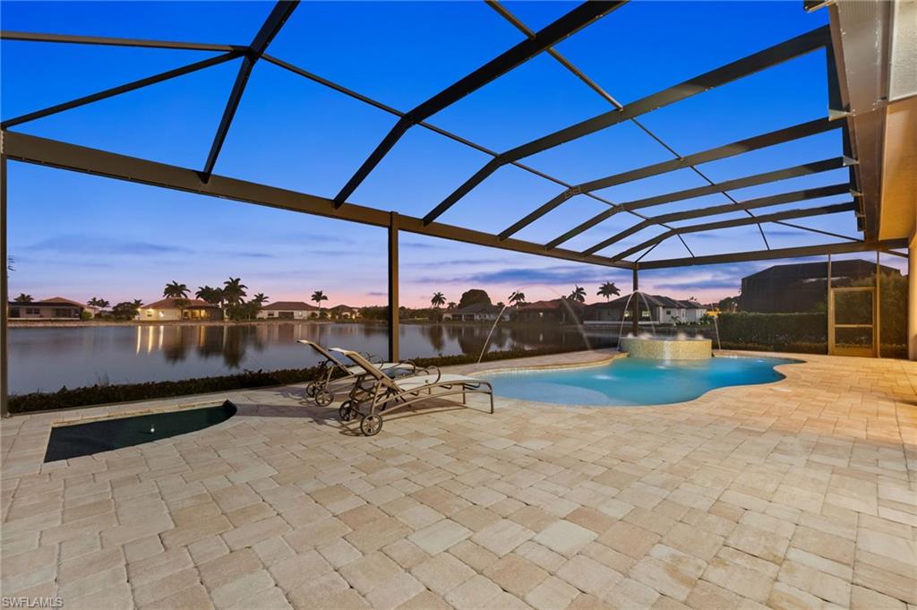 18018 Broadview Drive Naples, FL 34114 - Photo 40 of 46 a view of a swimming pool with sitting area