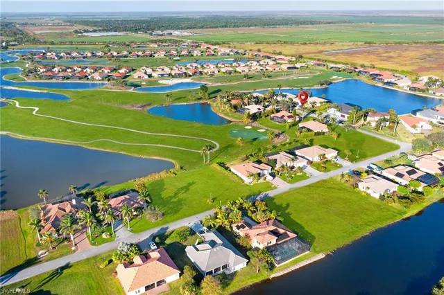 an aerial view of a house with garden space and outdoor seating