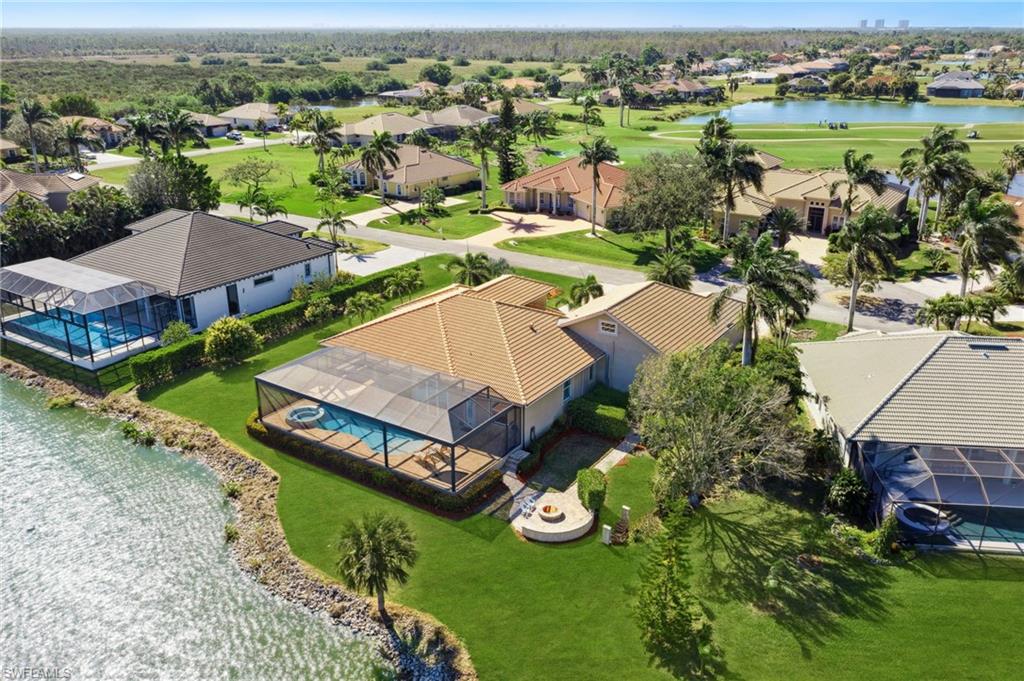 18018 Broadview Drive Naples, FL 34114 - Photo 44 of 46 an aerial view of a house with garden space and outdoor seating