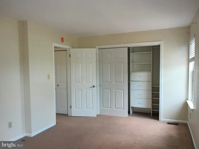 an empty room with closet