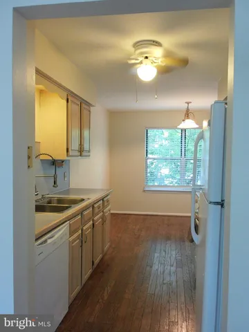 a kitchen that has a sink and a stove