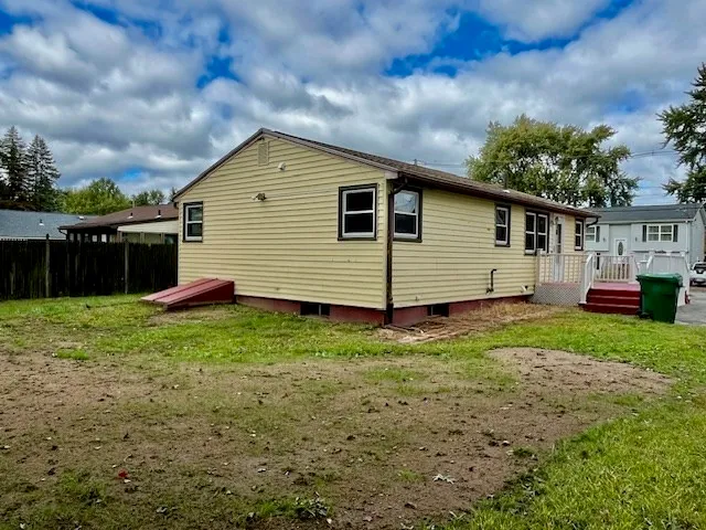 a backyard of a house with lots of green space