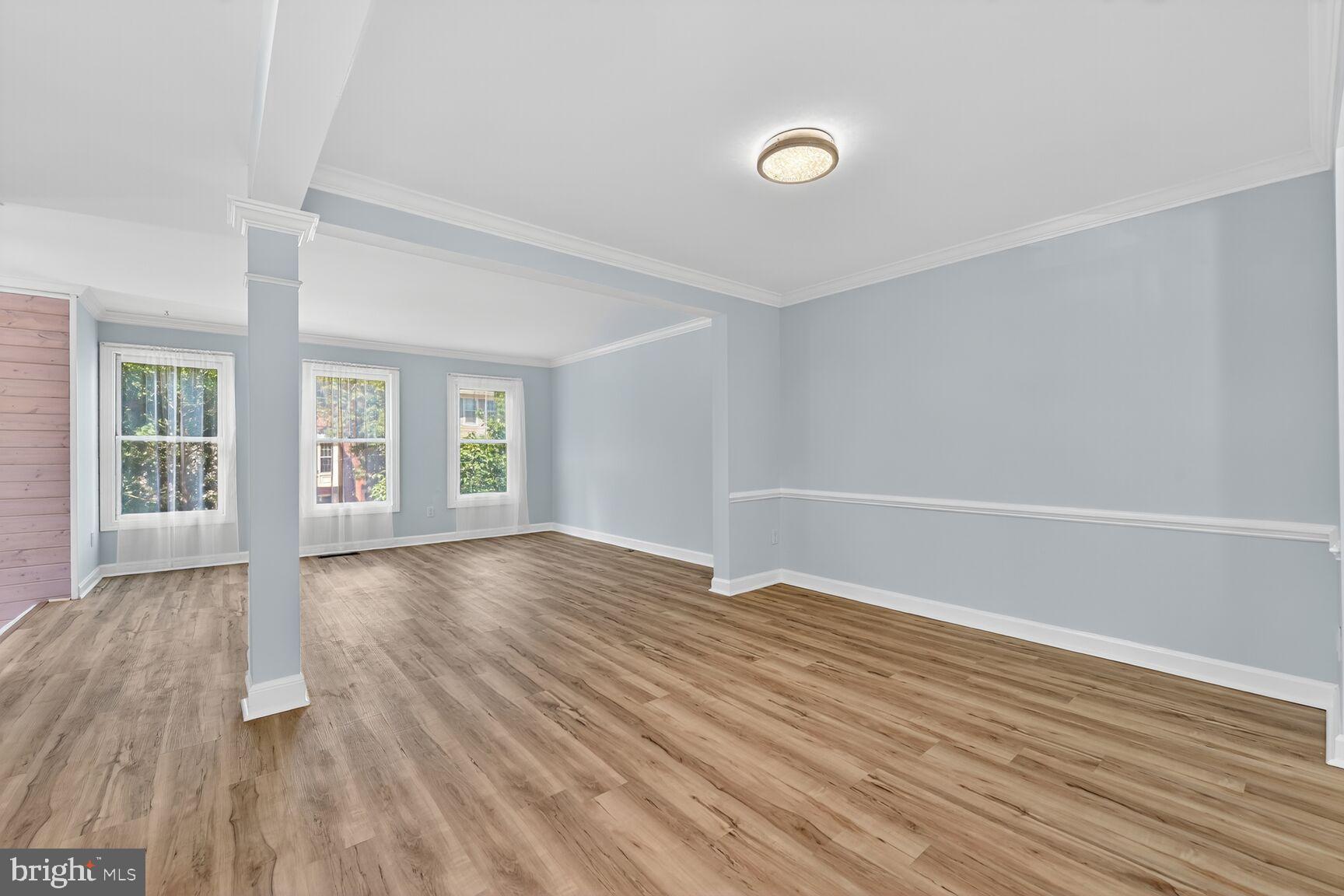 20970 Promontory Square Sterling, VA 20165 - Photo 11 of 44 a view of an empty room with wooden floor and a window