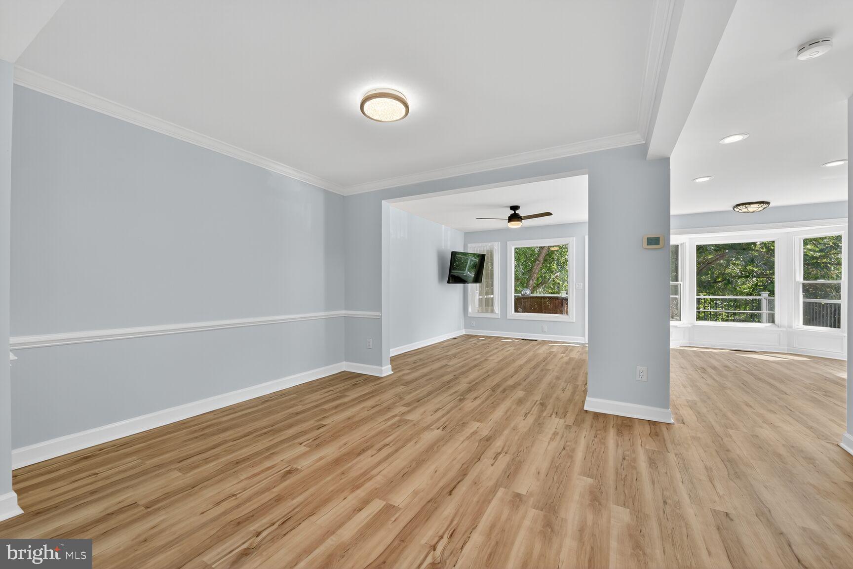 20970 Promontory Square Sterling, VA 20165 - Photo 12 of 44 a view of an empty room with wooden floor and a window