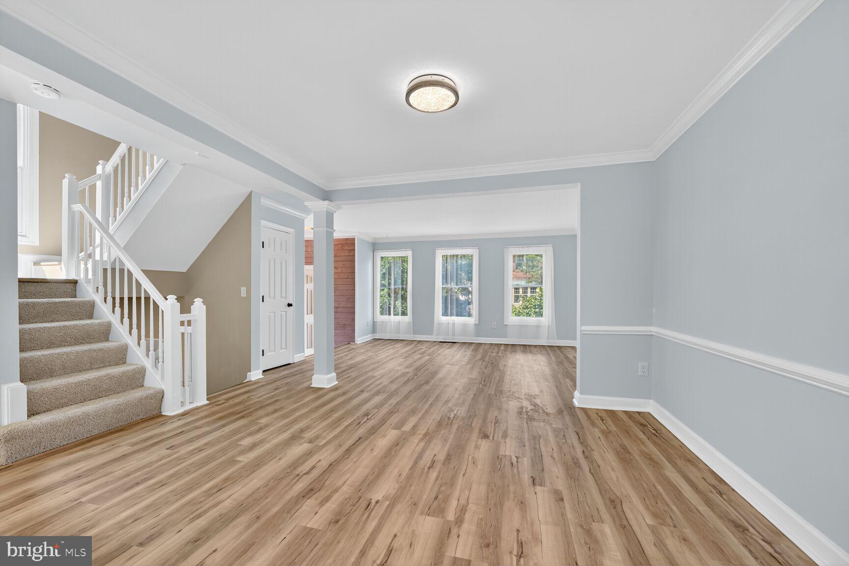 20970 Promontory Square Sterling, VA 20165 - Photo 13 of 44 a view of an empty room with wooden floor and a window