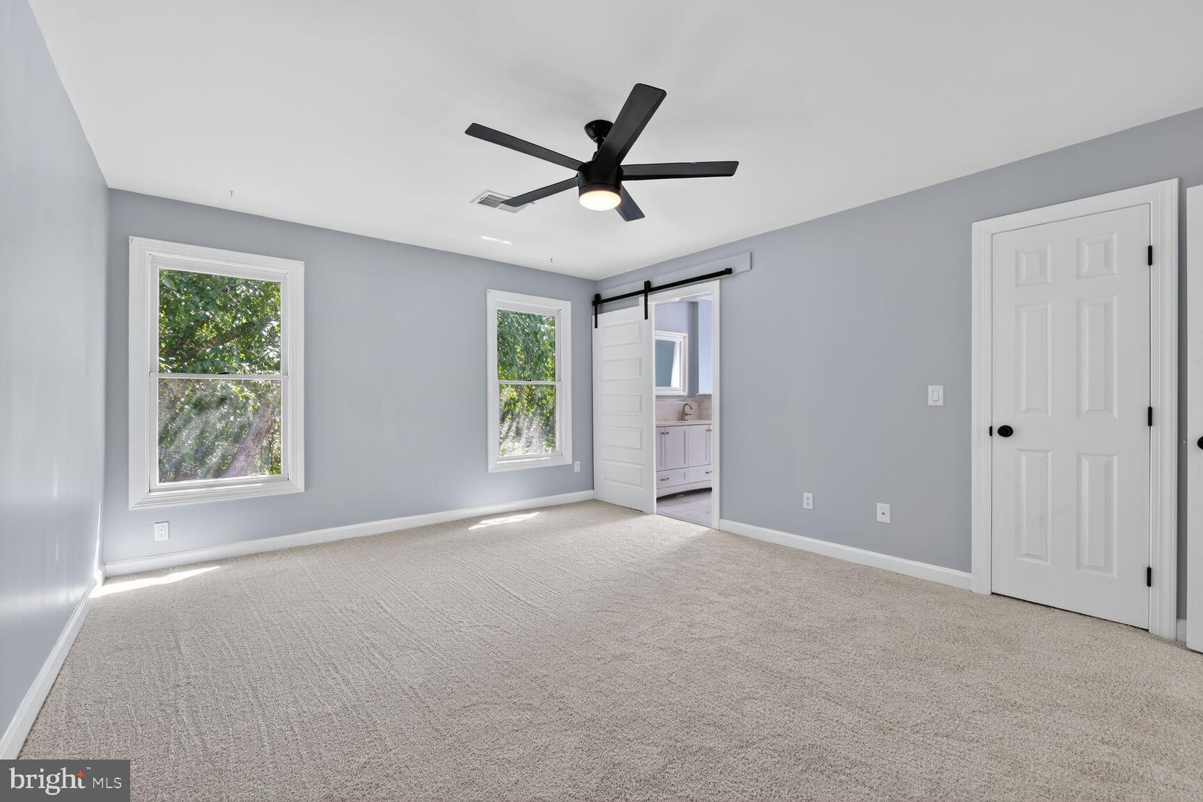 20970 Promontory Square Sterling, VA 20165 - Photo 17 of 44 a view of a livingroom with a ceiling fan and window
