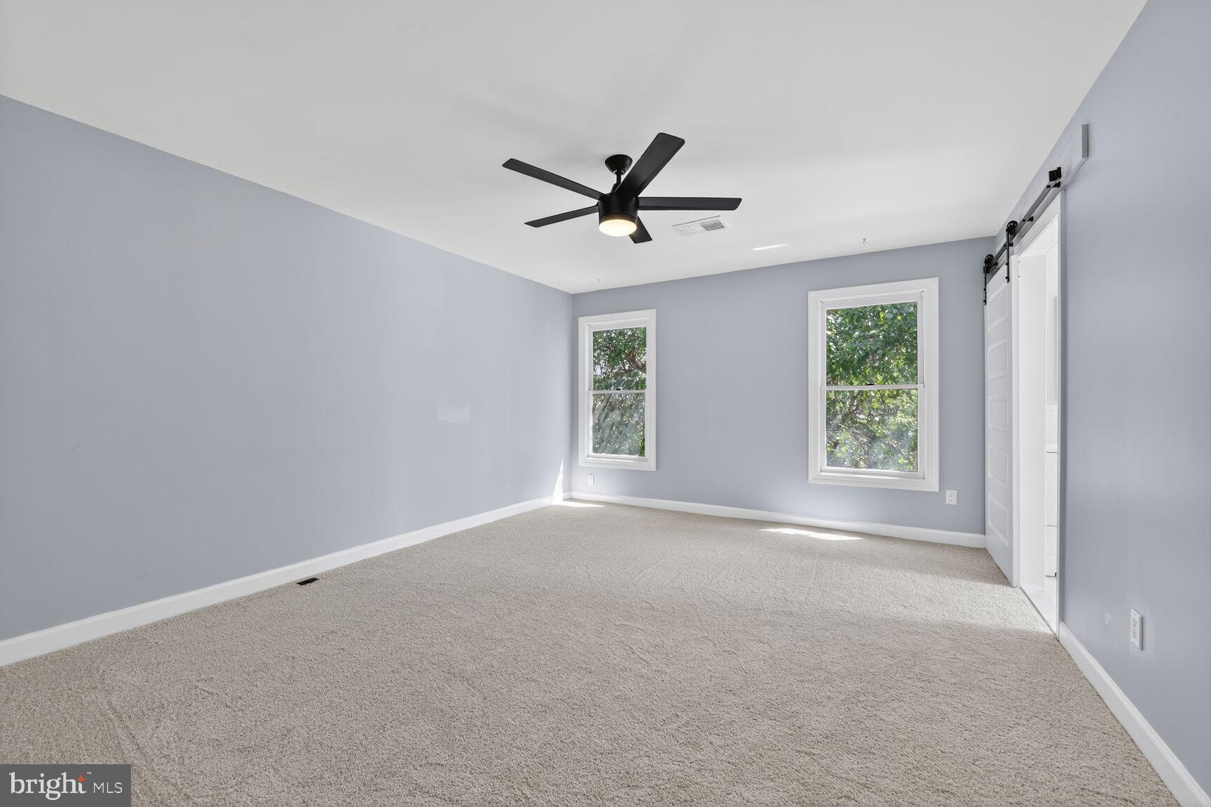 20970 Promontory Square Sterling, VA 20165 - Photo 19 of 44 a view of a livingroom with a ceiling fan and window