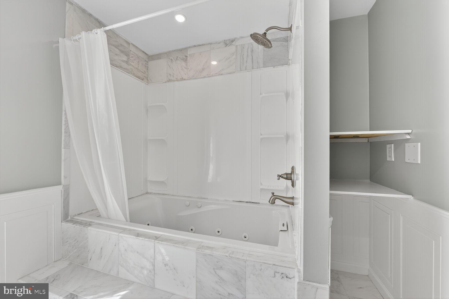 20970 Promontory Square Sterling, VA 20165 - Photo 22 of 44 a bathroom with a bathtub and a shower