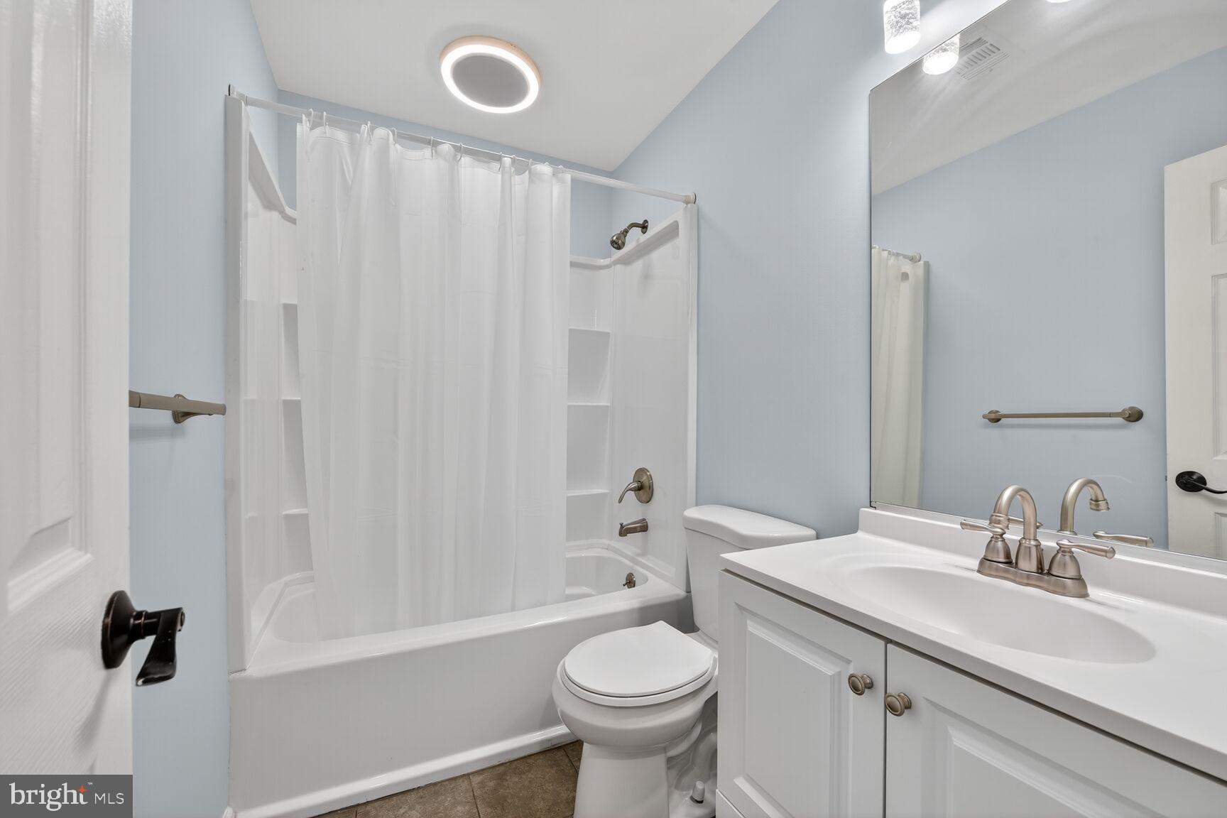 20970 Promontory Square Sterling, VA 20165 - Photo 25 of 44 a bathroom with a sink a toilet and a mirror