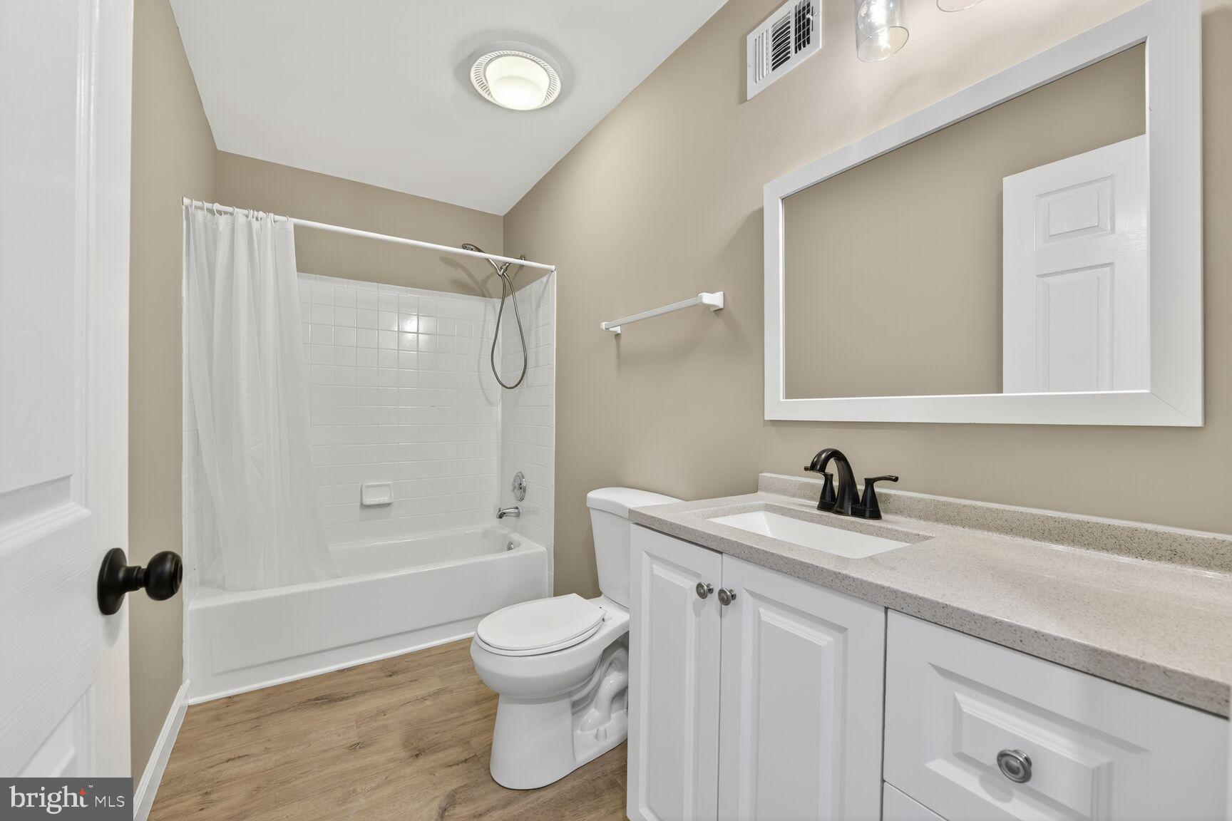 20970 Promontory Square Sterling, VA 20165 - Photo 30 of 44 a bathroom with a sink a toilet and shower