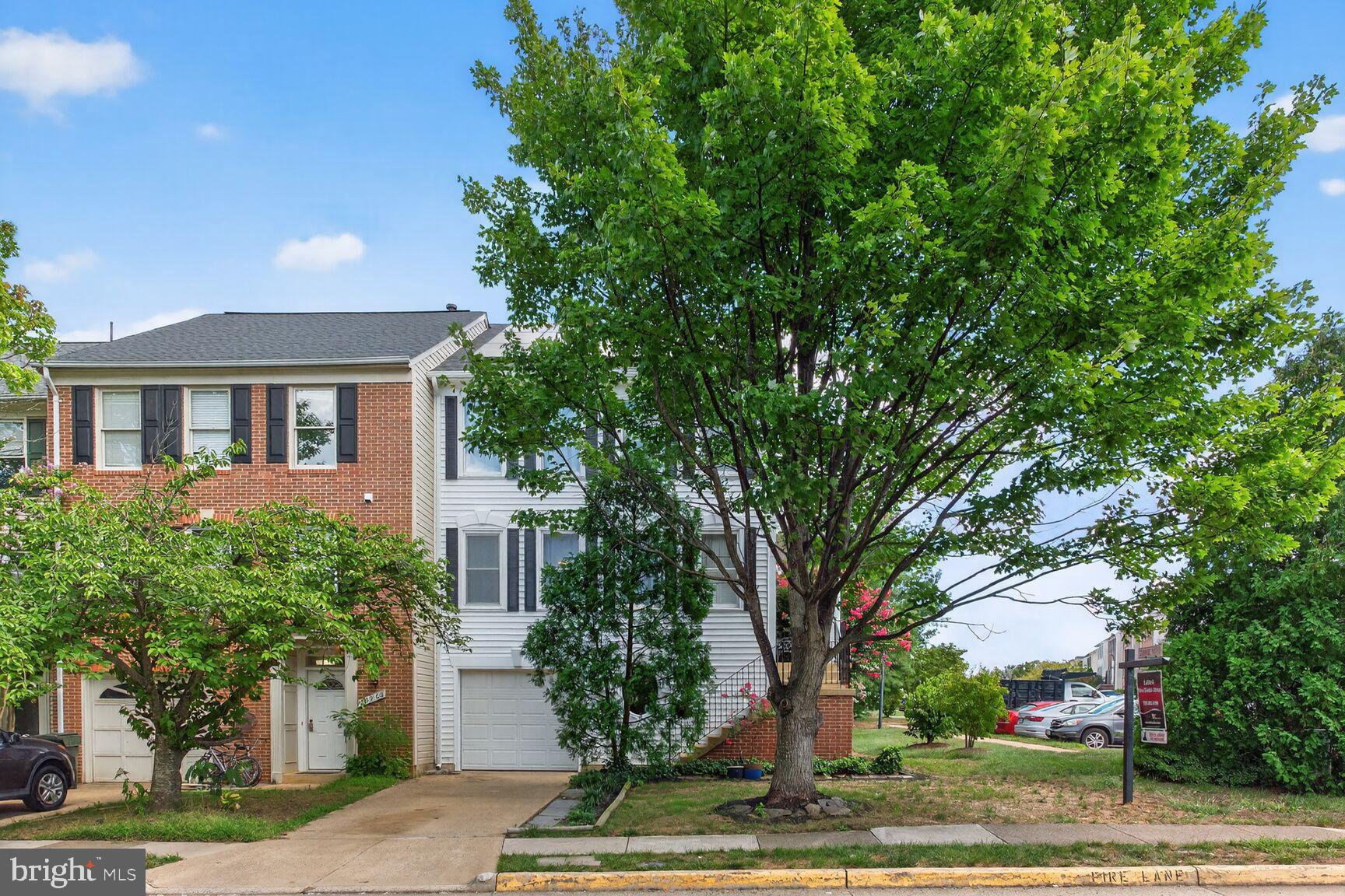 20970 Promontory Square Sterling, VA 20165 - Photo 34 of 44 a front view of a house with garden