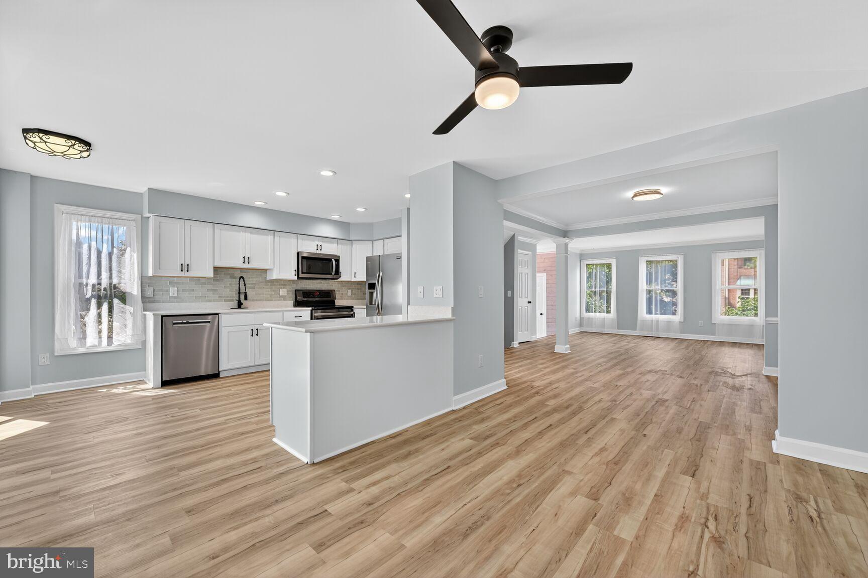 20970 Promontory Square Sterling, VA 20165 - Photo 6 of 44 a view of kitchen with refrigerator microwave and stove
