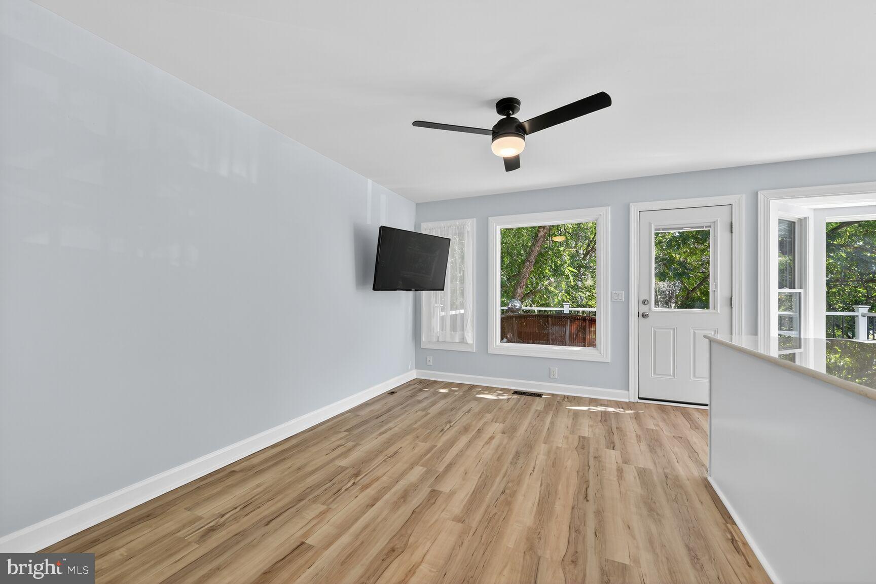 20970 Promontory Square Sterling, VA 20165 - Photo 7 of 44 a view of empty room with wooden floor and fan