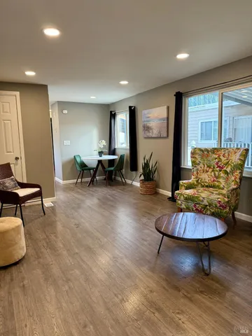 a living room with furniture and a table