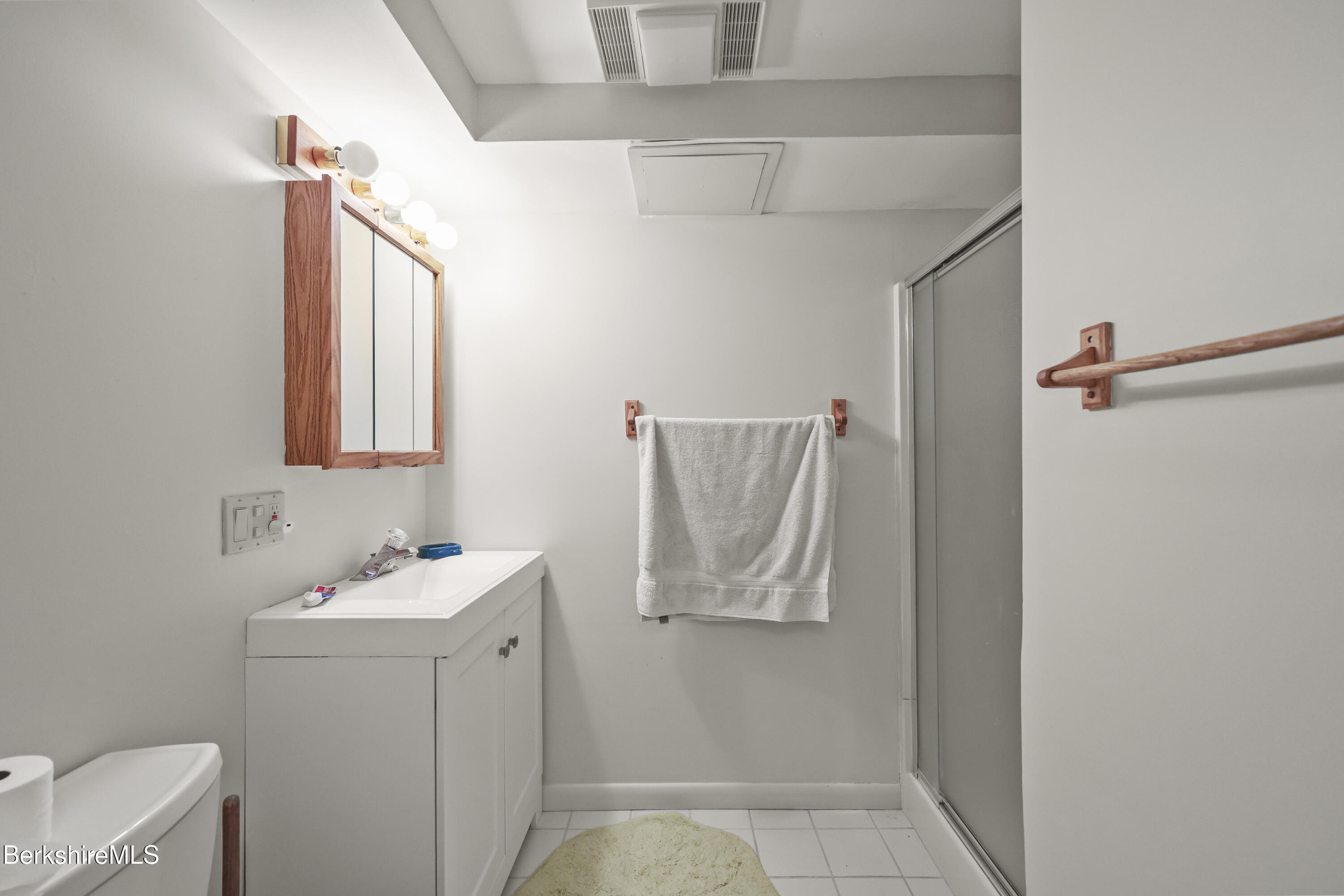 7 Rolling Hills, Unit 71 Lenox, MA 01240 - Photo 25 of 47 a bathroom with a sink and mirror with toilet