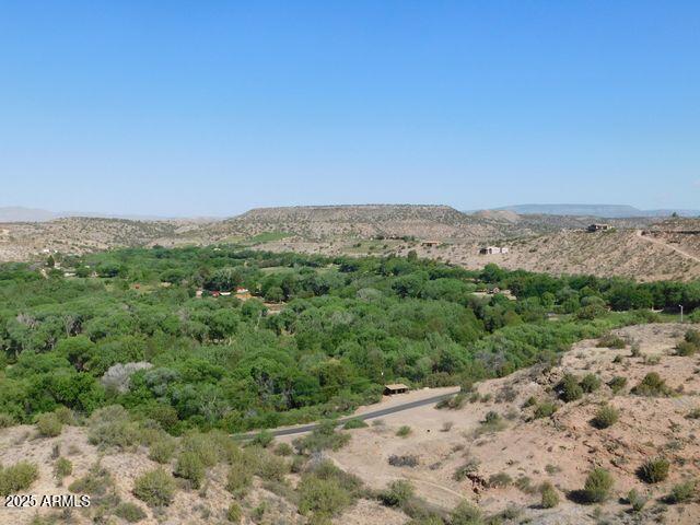 3 North Page Springs Road Sedona, AZ 86336 - Photo 10 of 12 a view of a mountain range with trees in the background